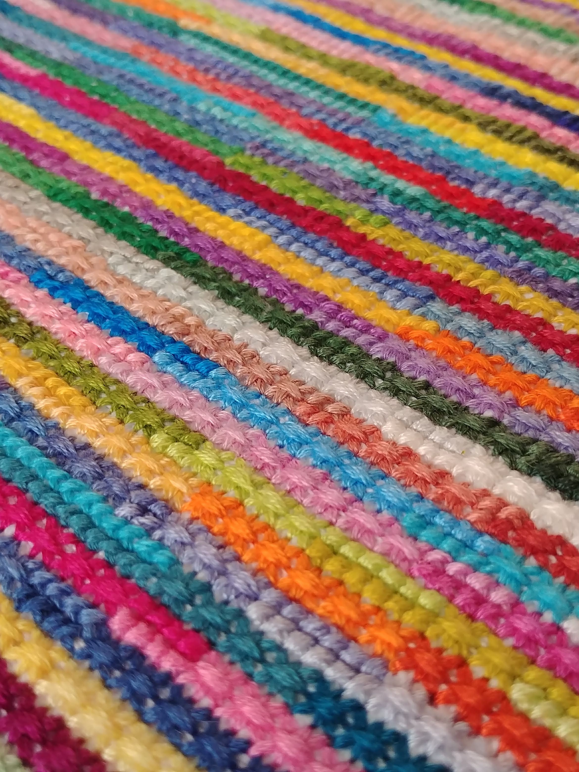 Designer hand embroidered canvas in contemporary meditation style playing with shades of colors